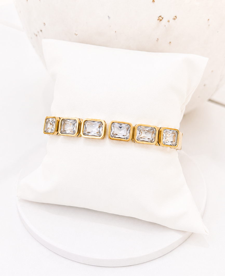 
                  
                    Close-up of the Lorienne Gold Emerald-Cut Crystal Bangle
                  
                