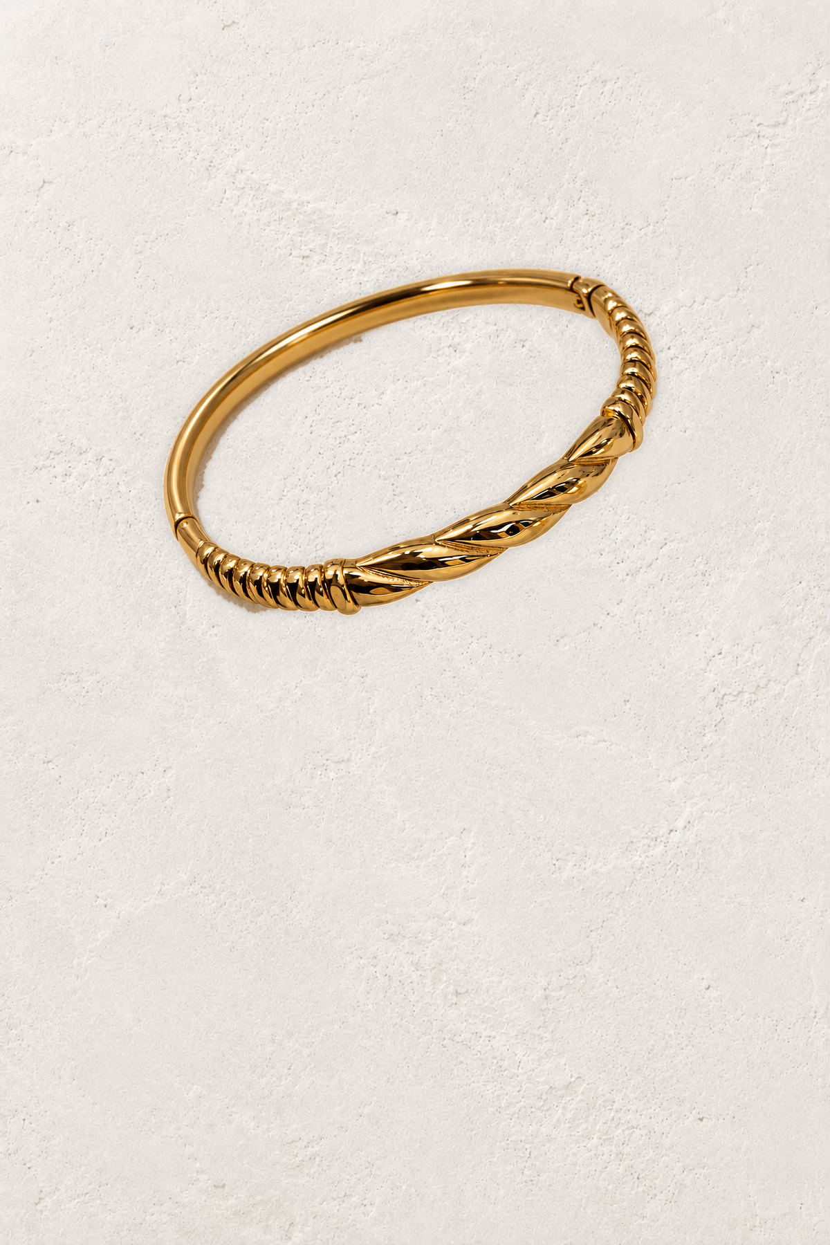 
                  
                    Alessia Gold Diagonal Ribbed Bangle on the reference plaster background
                  
                