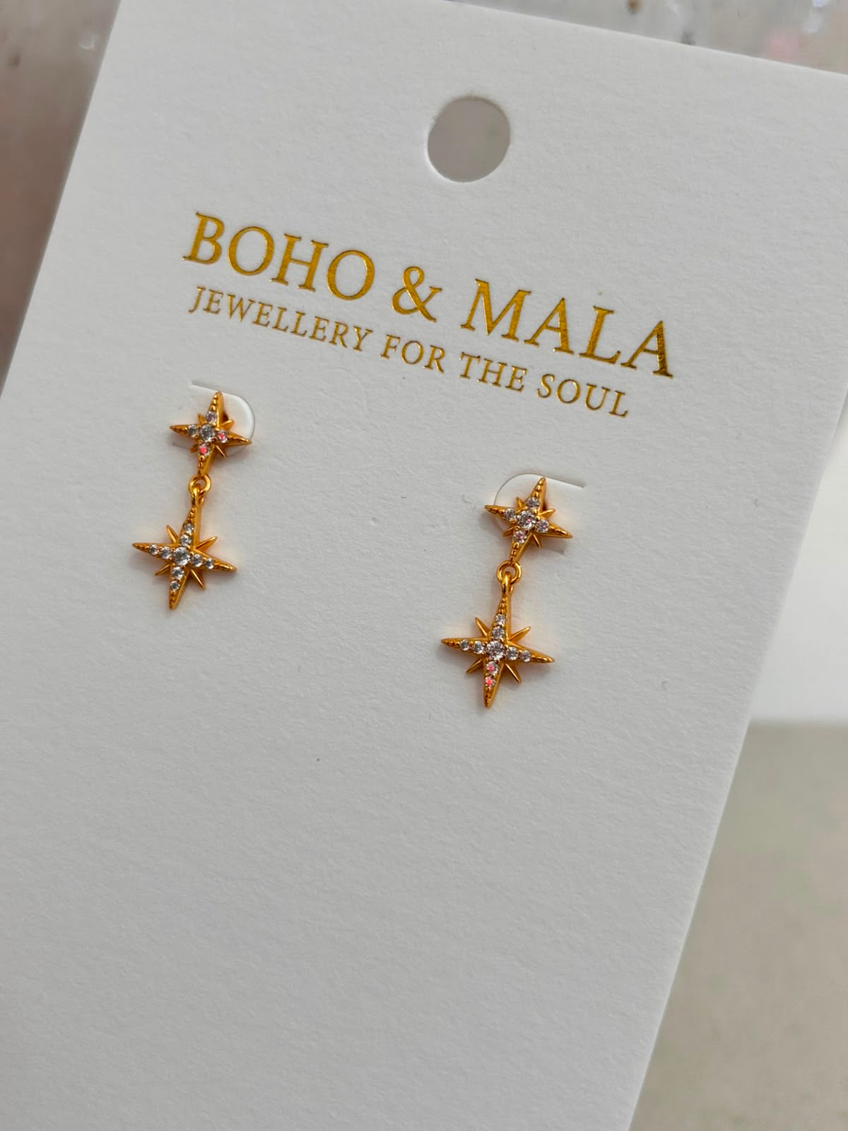
                  
                    Celia Gold Stud Earrings
                  
                