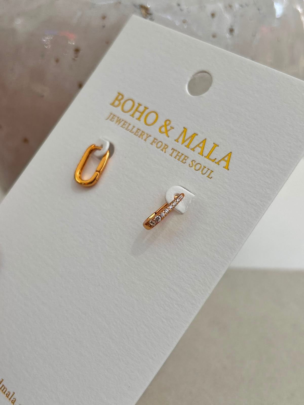 
                  
                    Nova Gold Hoop Earrings
                  
                