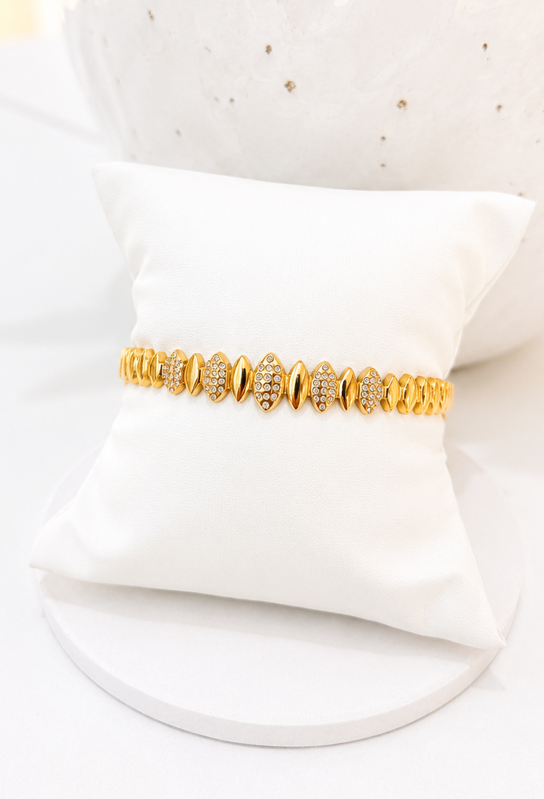
                  
                    Close-up of the Solvaya Sculpted Gold Crystal Bangle
                  
                