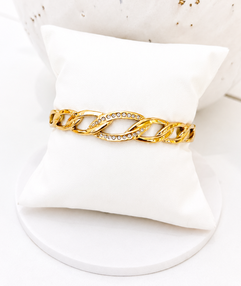 
                  
                    Close-up of the Celeste Gold Crystal Link Bangle
                  
                