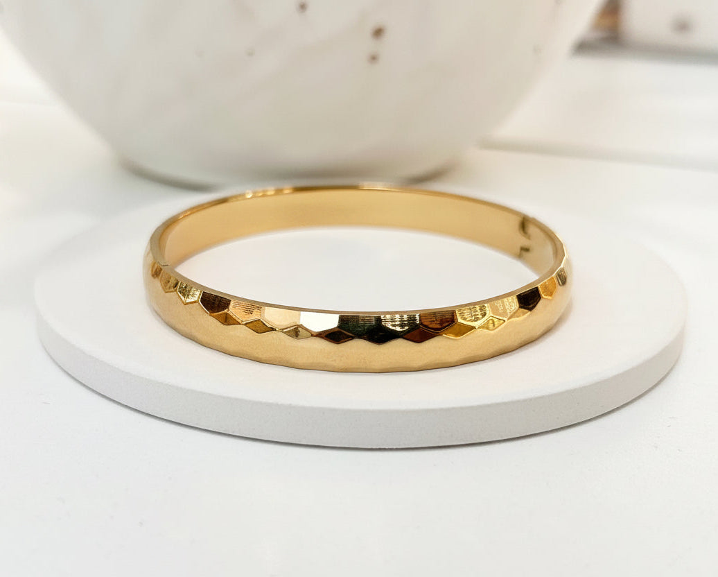 
                  
                    Close-up of the Valenza Hammered Gold Bangle
                  
                
