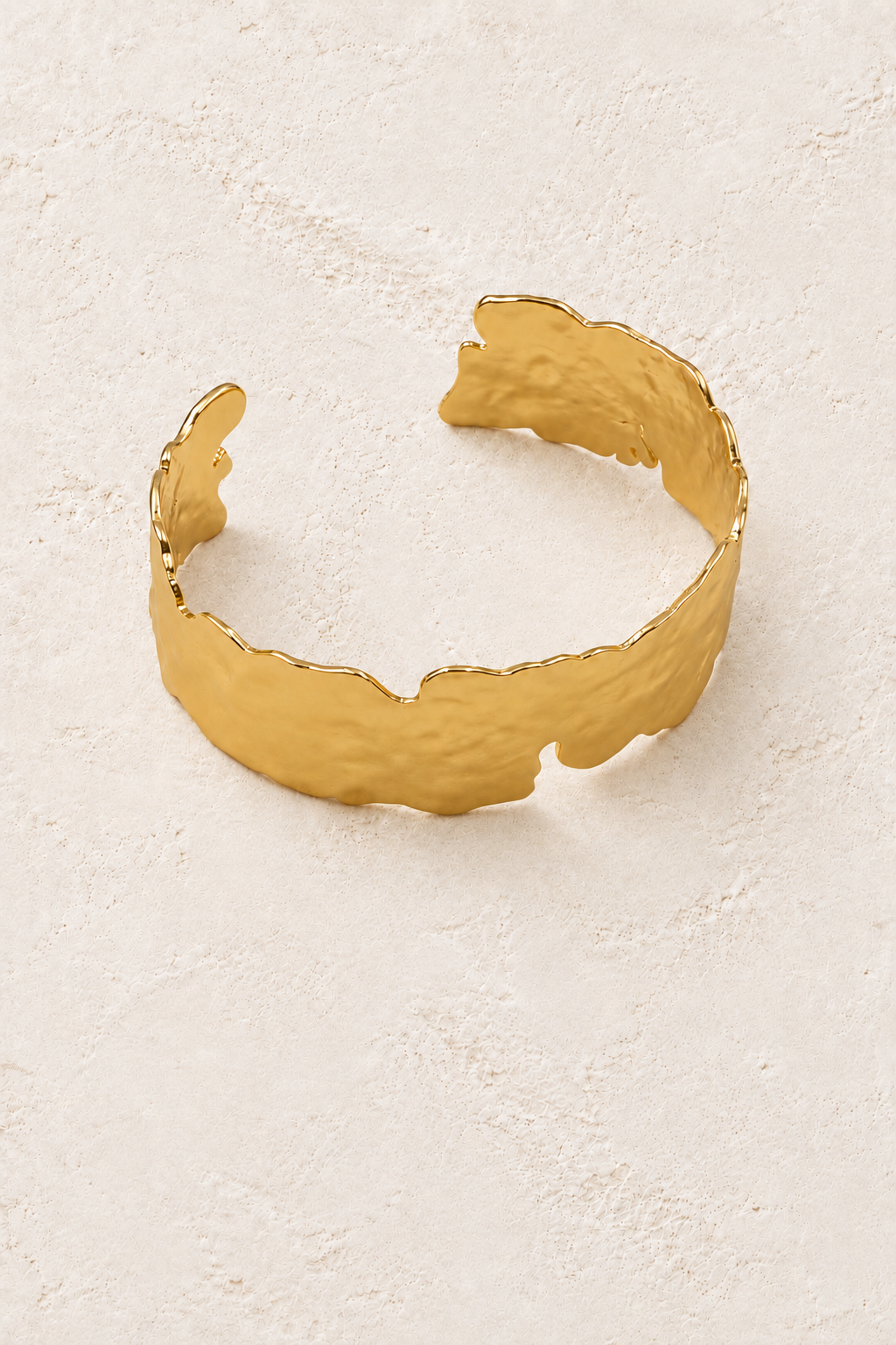 Free Spirit Adjustable Statement Boho Brass Gold Cuff Bracelet Large on warm ivory plaster