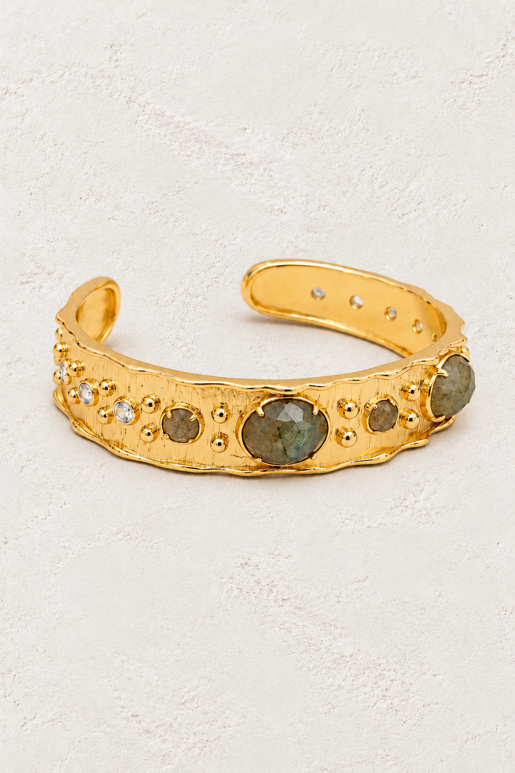 Labradorite Solara Cuff Bracelet on warm ivory plaster