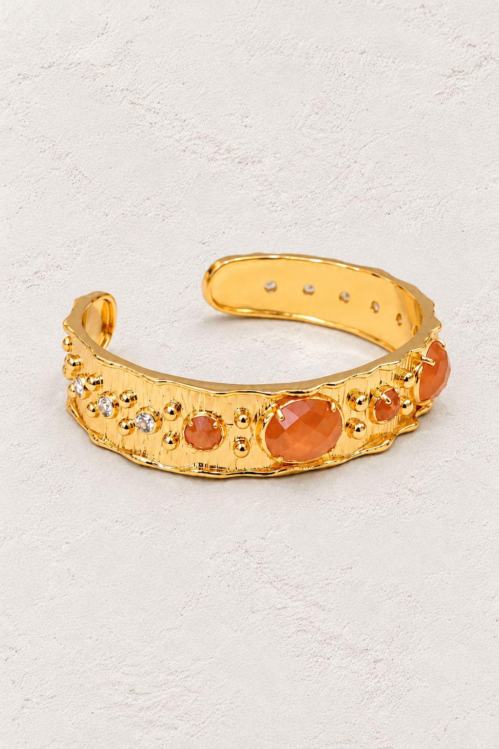 Sunstone Solara Cuff Bracelet on warm ivory plaster