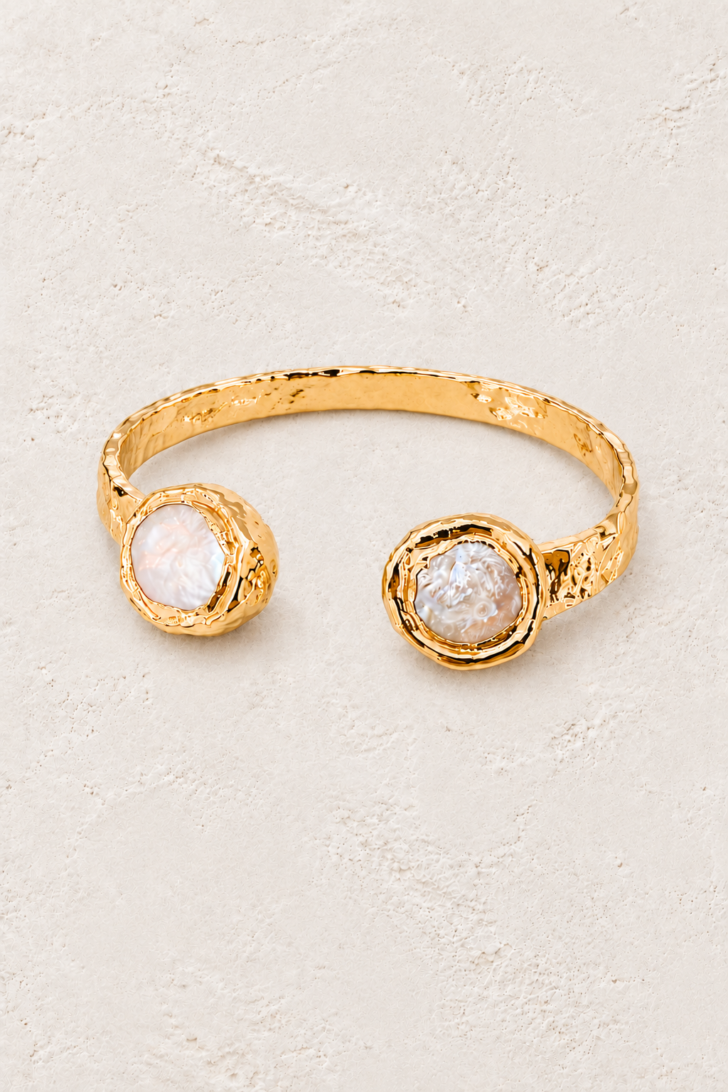 Circular Thalassa Fresh Water Pearl Cuff Bracelet on warm ivory plaster