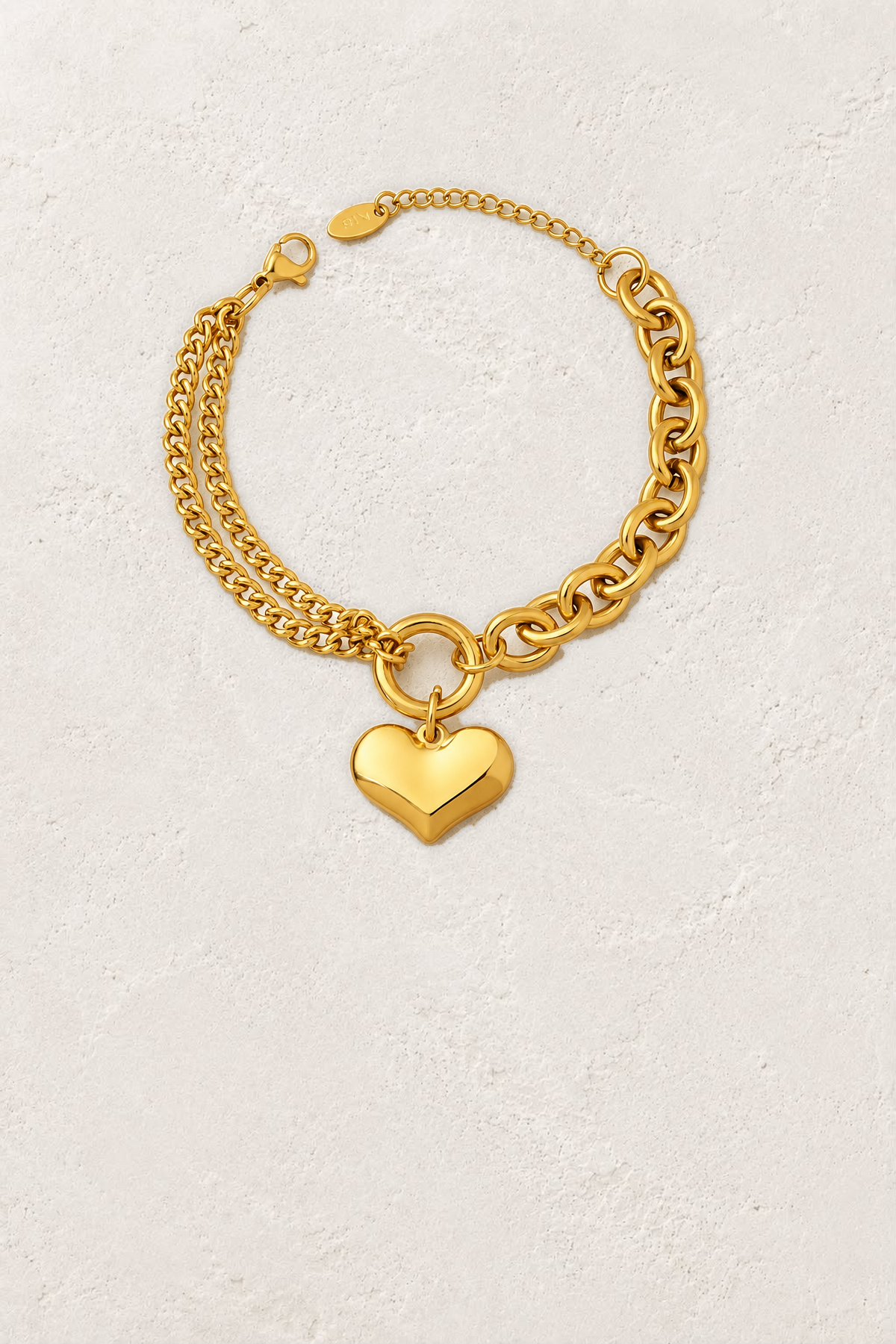 
                  
                    Amour Gold Heart Chain Bracelet on the reference plaster background
                  
                