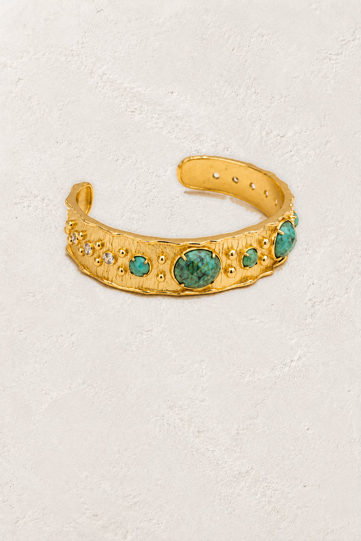 
                  
                    African Turquoise Solara Cuff Bracelet on the reference plaster background
                  
                