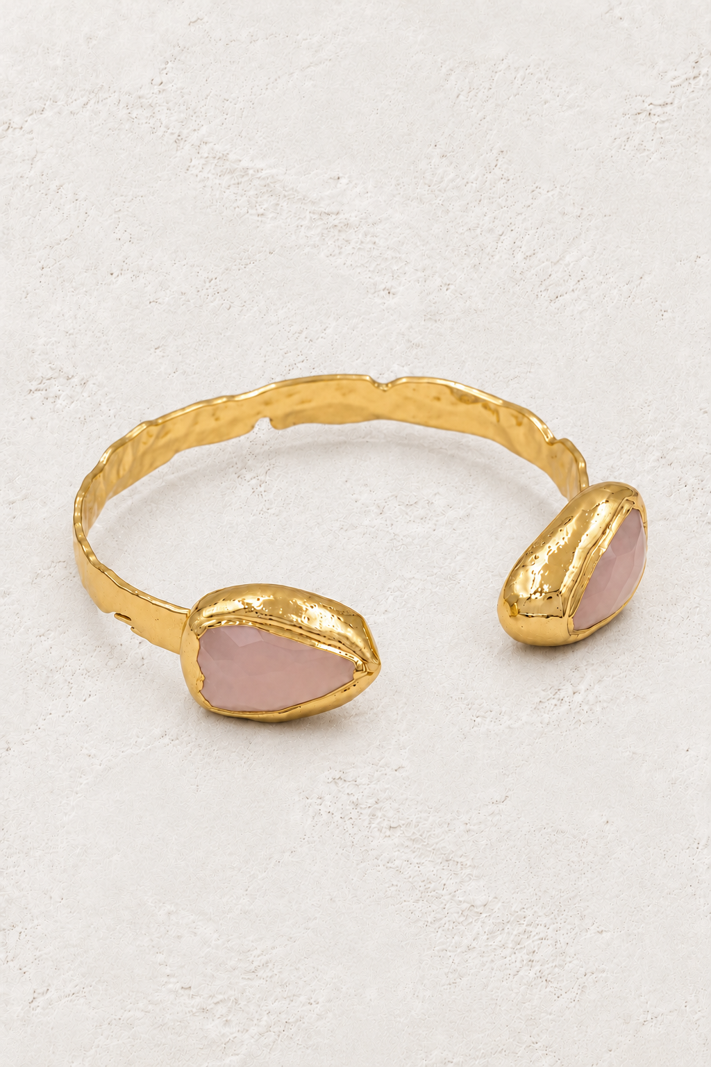 Coralia Rose Quartz Cuff on warm ivory plaster