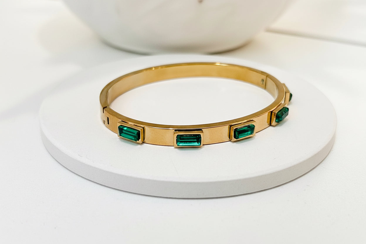 
                  
                    Close-up of the Emerelle Green Crystal Gold Bangle
                  
                