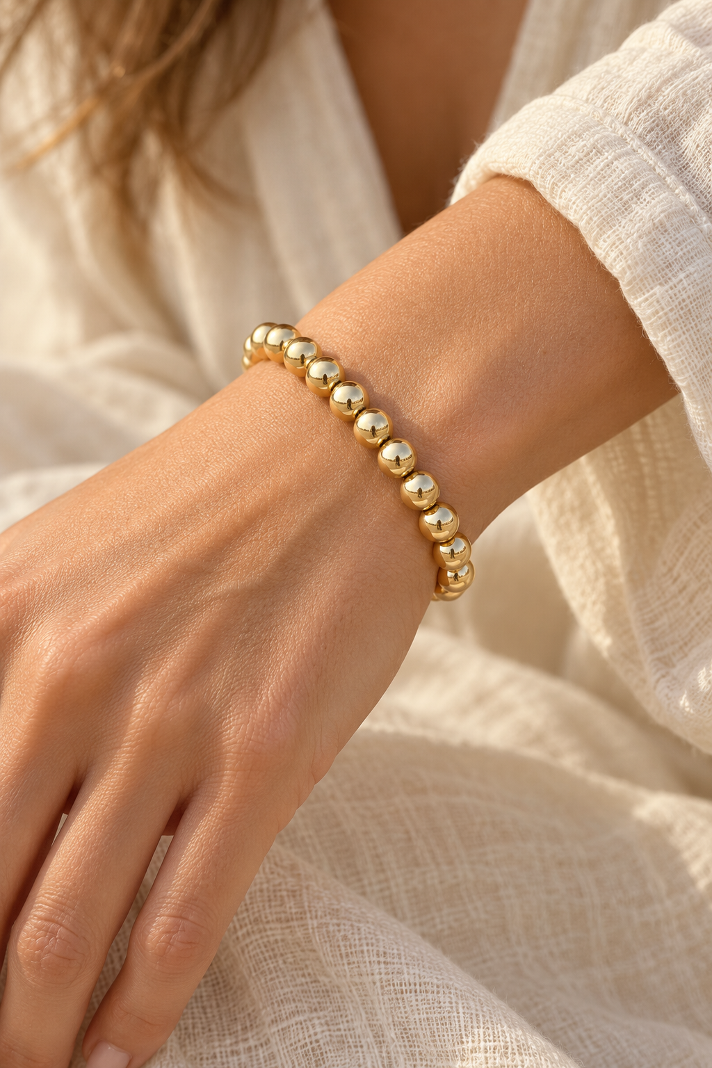 8mm Gold Plated Beaded Elastic Bracelet TF worn on a model's wrist