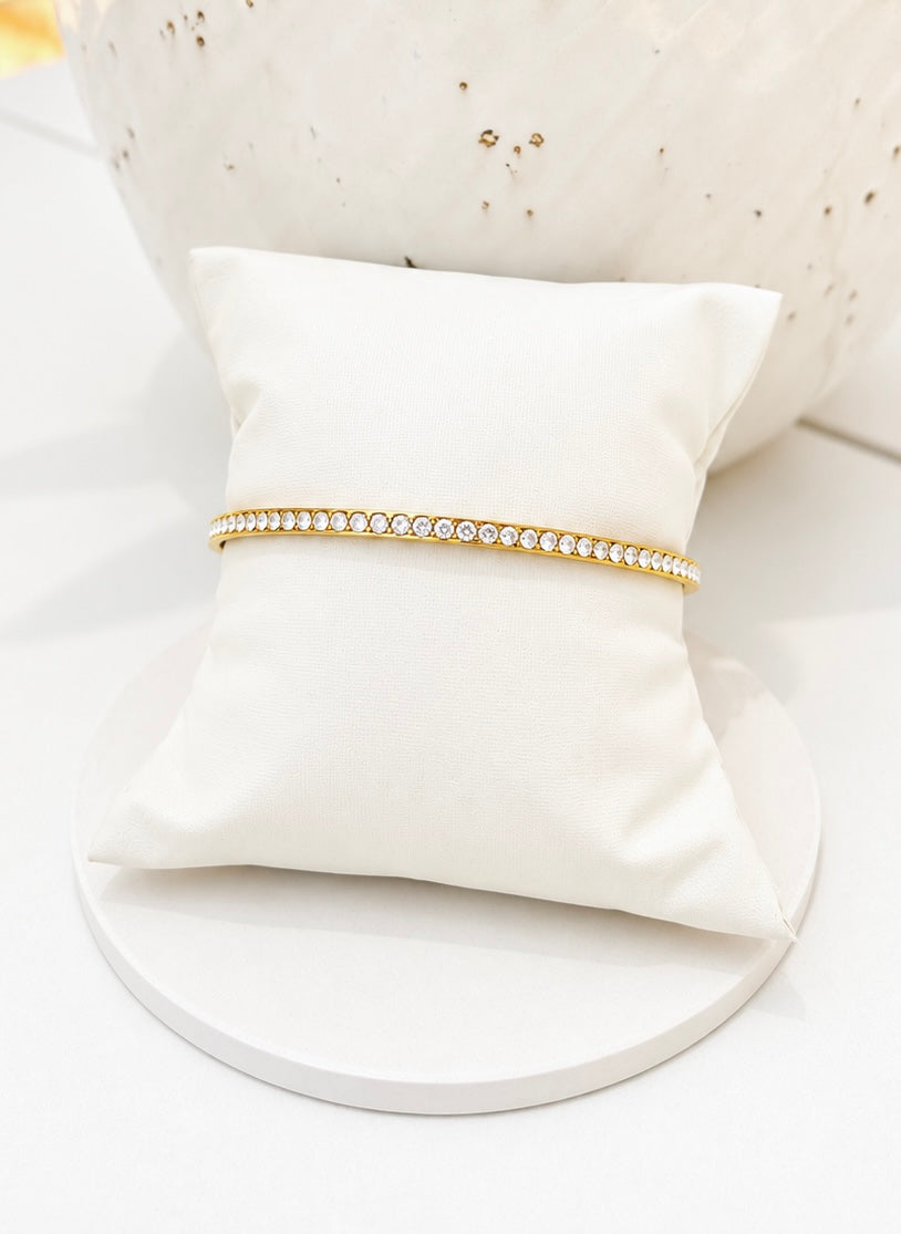 
                  
                    Close-up of the Elara Gold Tennis Bangle
                  
                