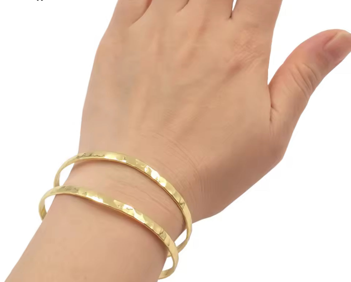 
                  
                    Free Spirit Boho Brass & Gold Cuff Bracelet worn on a model's wrist
                  
                