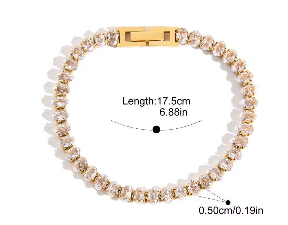 
                  
                    Close-up of the Aurora Oval Crystal Gold Tennis Bracelet
                  
                