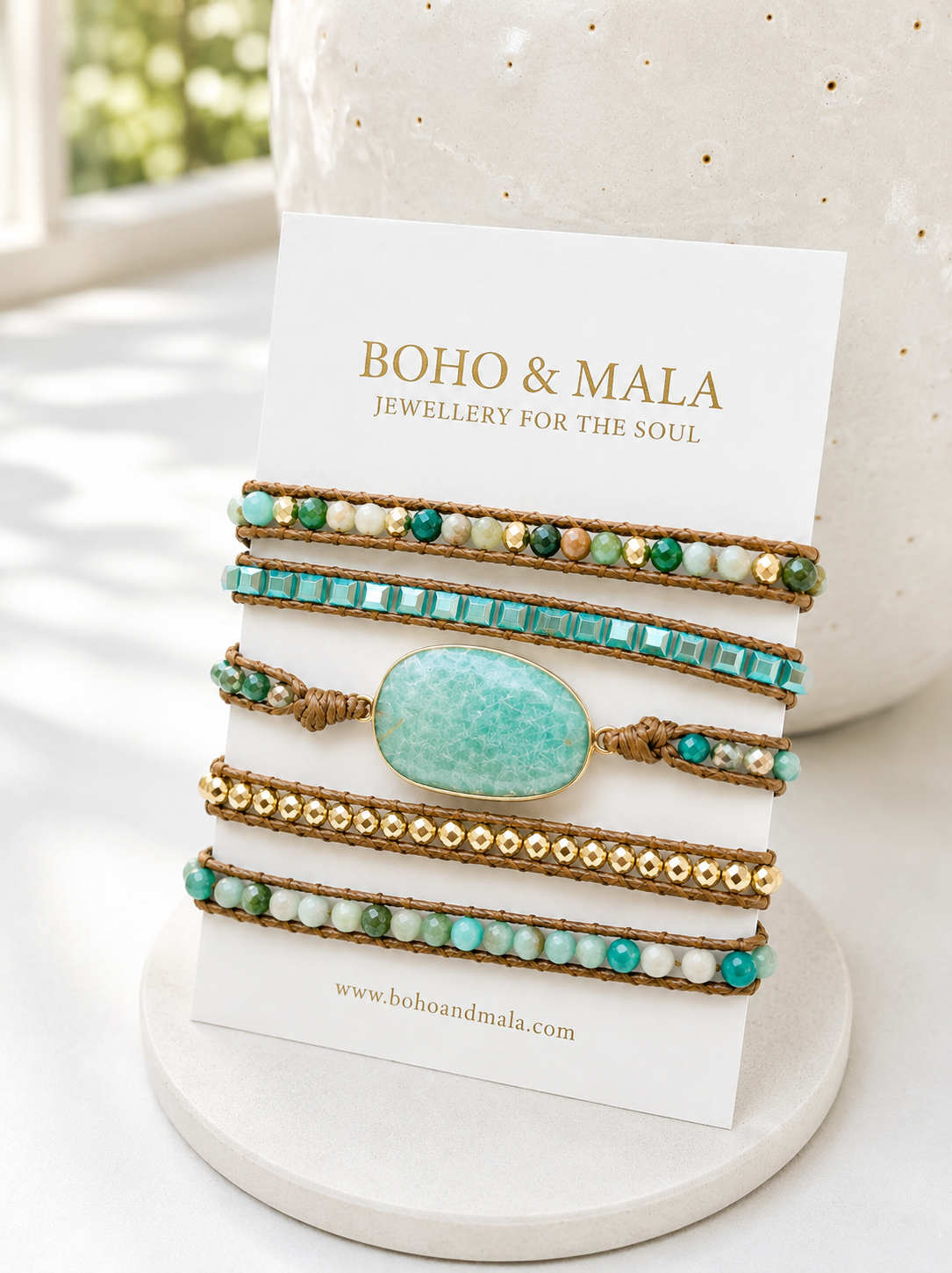 
                  
                    Set of boho light amazonite bracelets on a display card with 'Boho & Mala' branding.
                  
                
