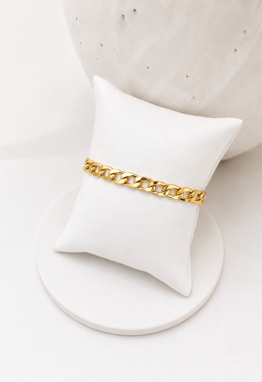 
                  
                    Luna Classic Oval Gold Bangle displayed on a white stand
                  
                