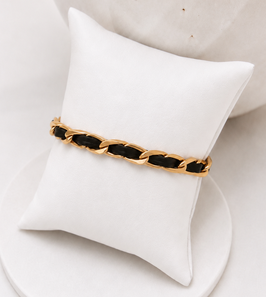 
                  
                    Close-up of the Noir Luxe Black Enamel Gold Chain Bracelet
                  
                