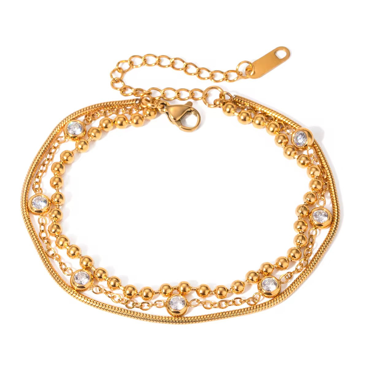 
                  
                    Luna Gold Crystal Layered Bracelet displayed on a white stand
                  
                