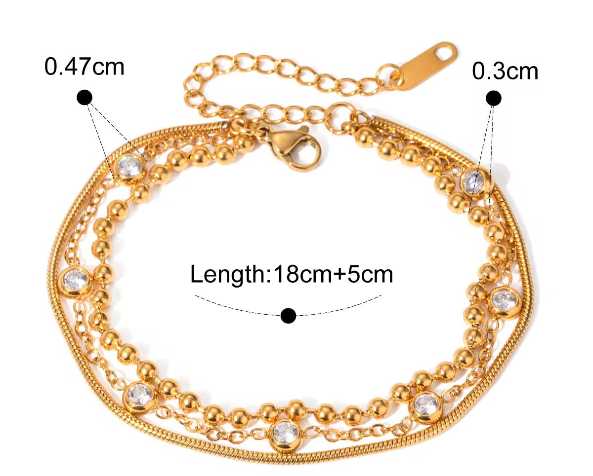 
                  
                    Close-up of the Luna Gold Crystal Layered Bracelet
                  
                