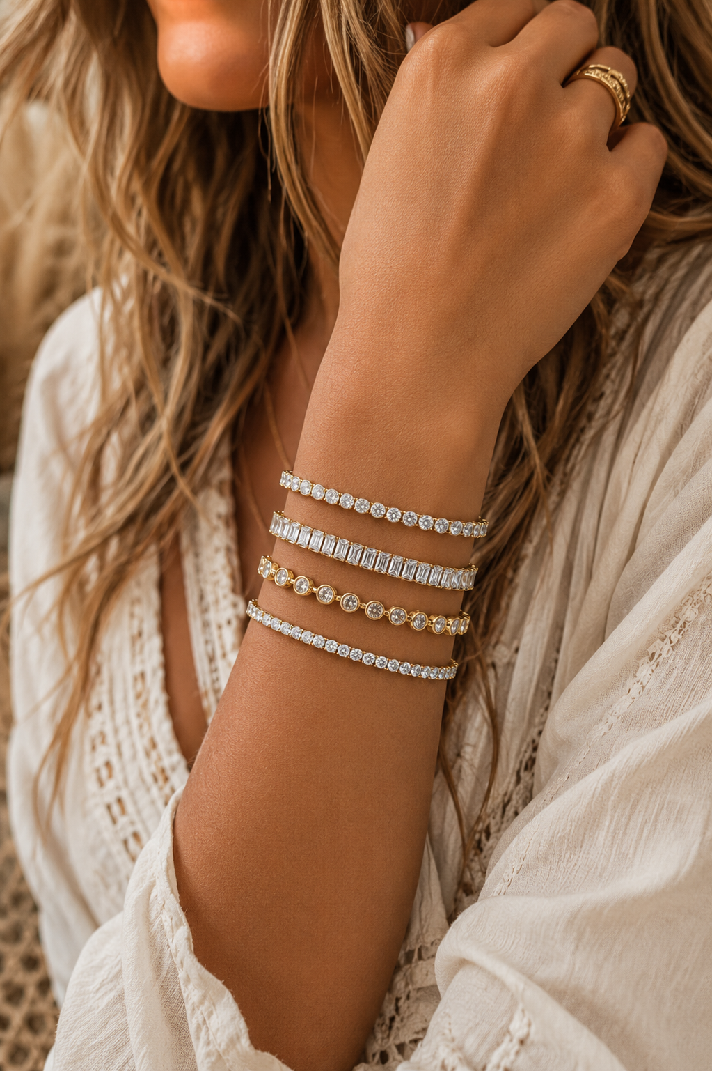 
                  
                    Stack of Boho & Mala waterproof gold bangles worn on a model's wrist
                  
                