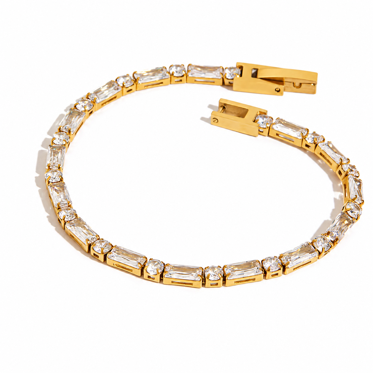
                  
                    Close-up of the Avelisse Emerald & Round Crystal Gold Tennis Bracelet
                  
                