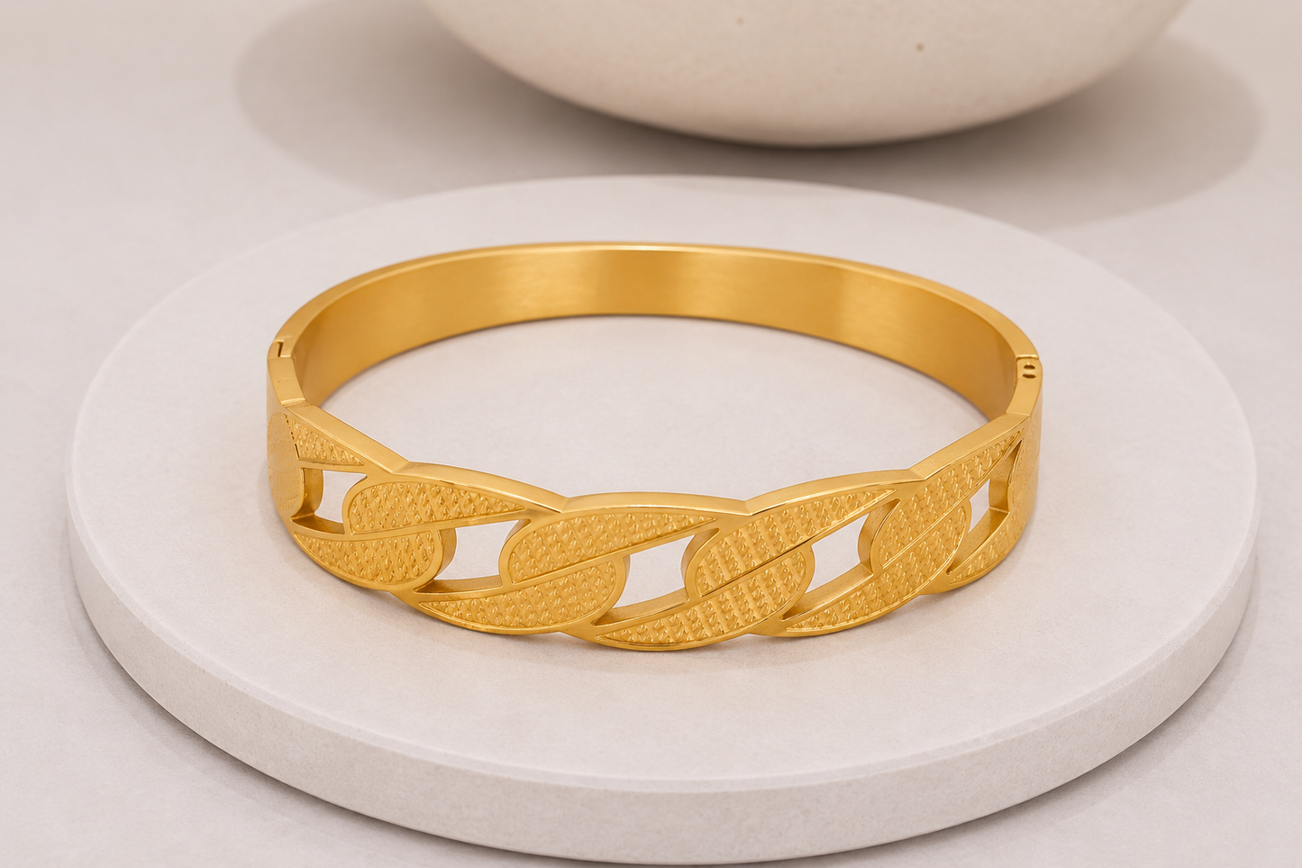 
                  
                    Close-up of the Aurora Link Gold Bangle
                  
                