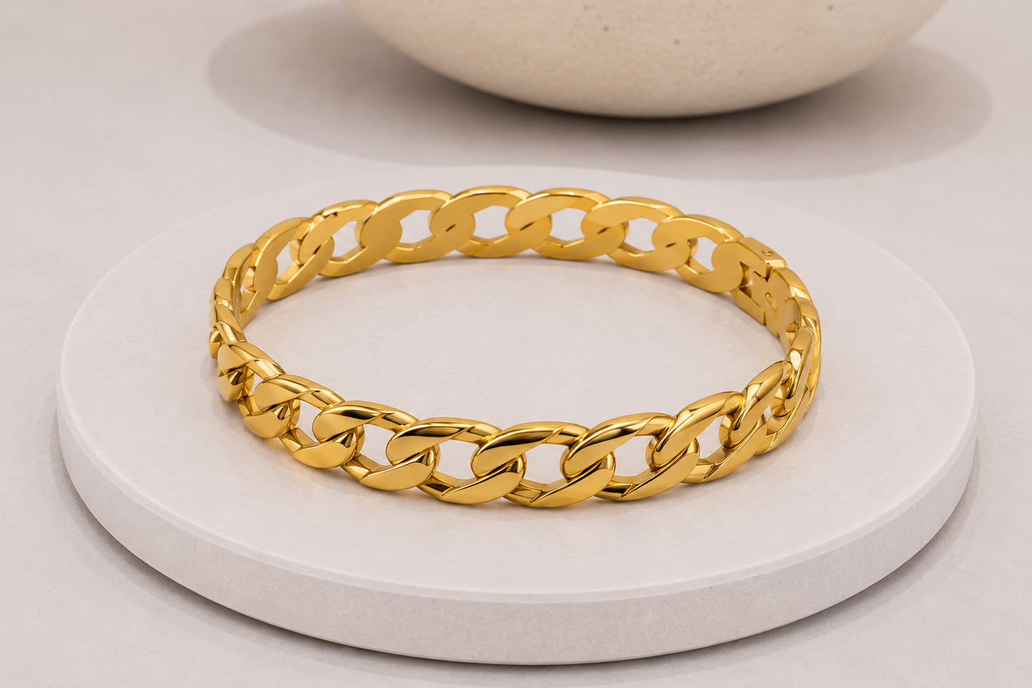 
                  
                    Close-up of the Luna Classic Oval Gold Bangle
                  
                