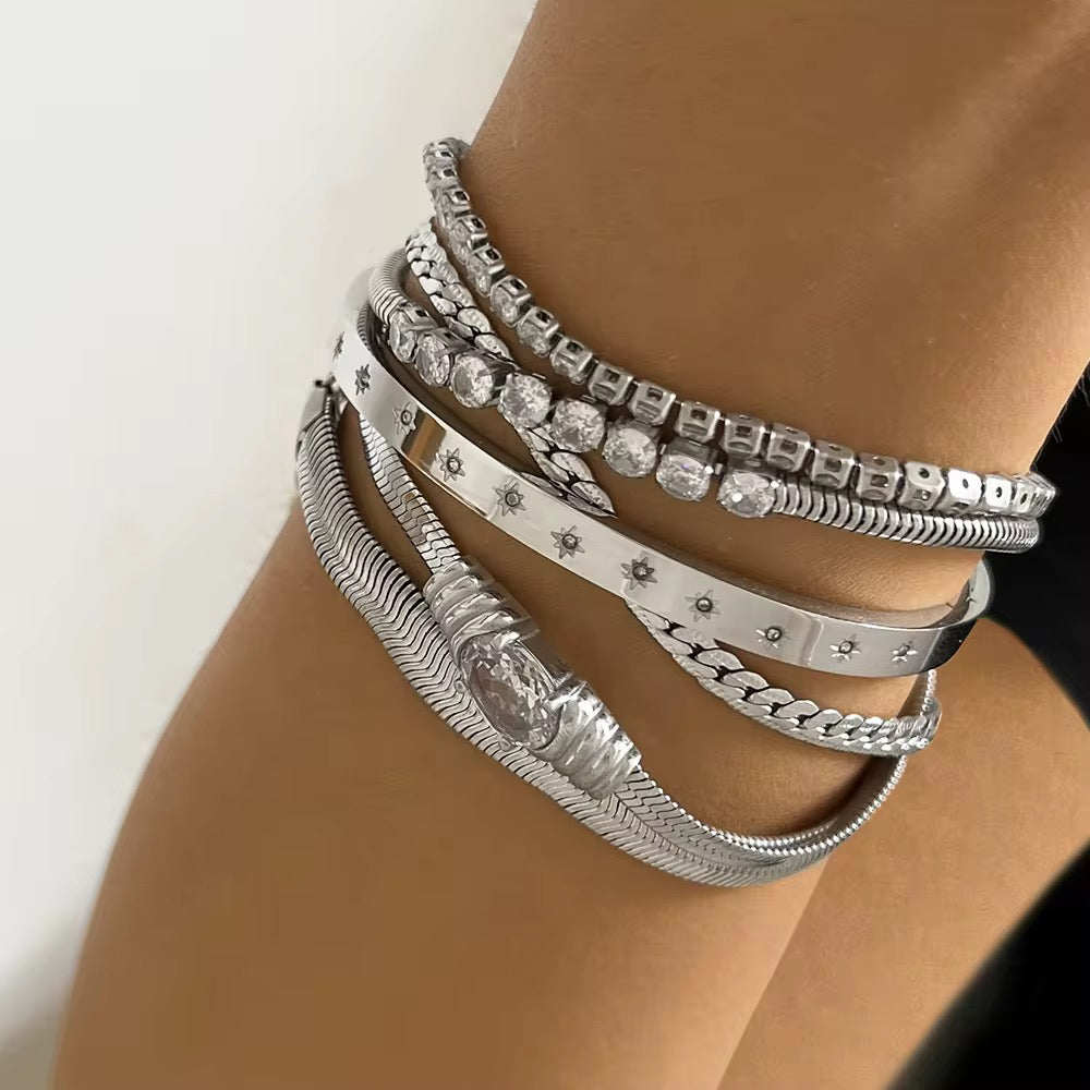 
                  
                    Boho Gold Stainless Steel Bracelet displayed on a white stand
                  
                