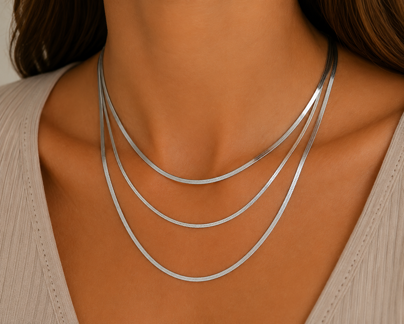 
                  
                    Sienna Silver Triple Layer Herringbone Necklace – Waterproof Stainless Steel
                  
                