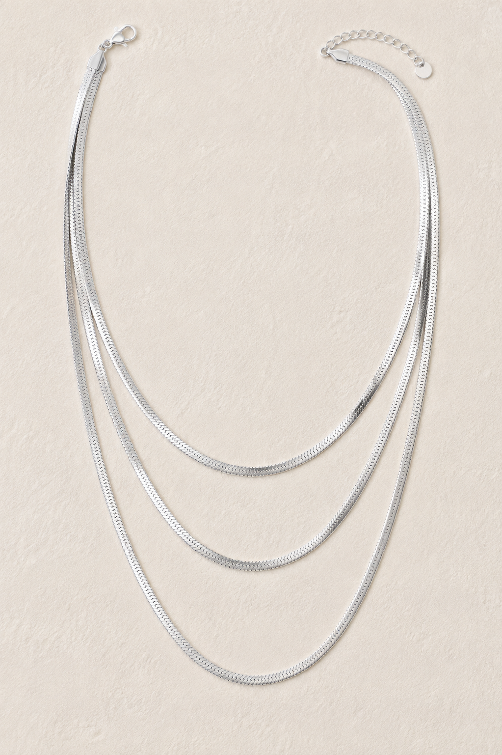 
                  
                    Sienna Silver Triple Layer Herringbone Necklace – Waterproof Stainless Steel
                  
                