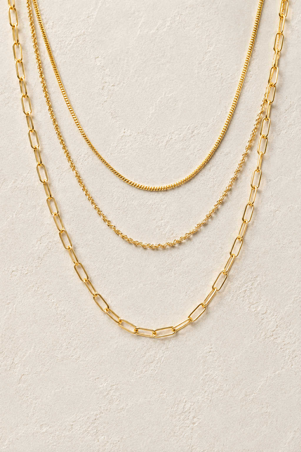 
                  
                    Sorrento Triple Layer Chain Necklace – Waterproof Gold-Plated Stainless Steel
                  
                