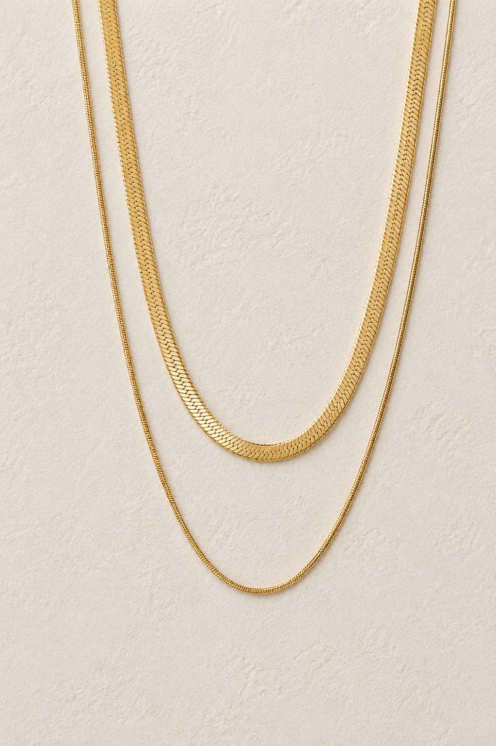 
                  
                    Mila Double Layer Herringbone Necklace – Waterproof Gold-Plated Stainless Steel
                  
                