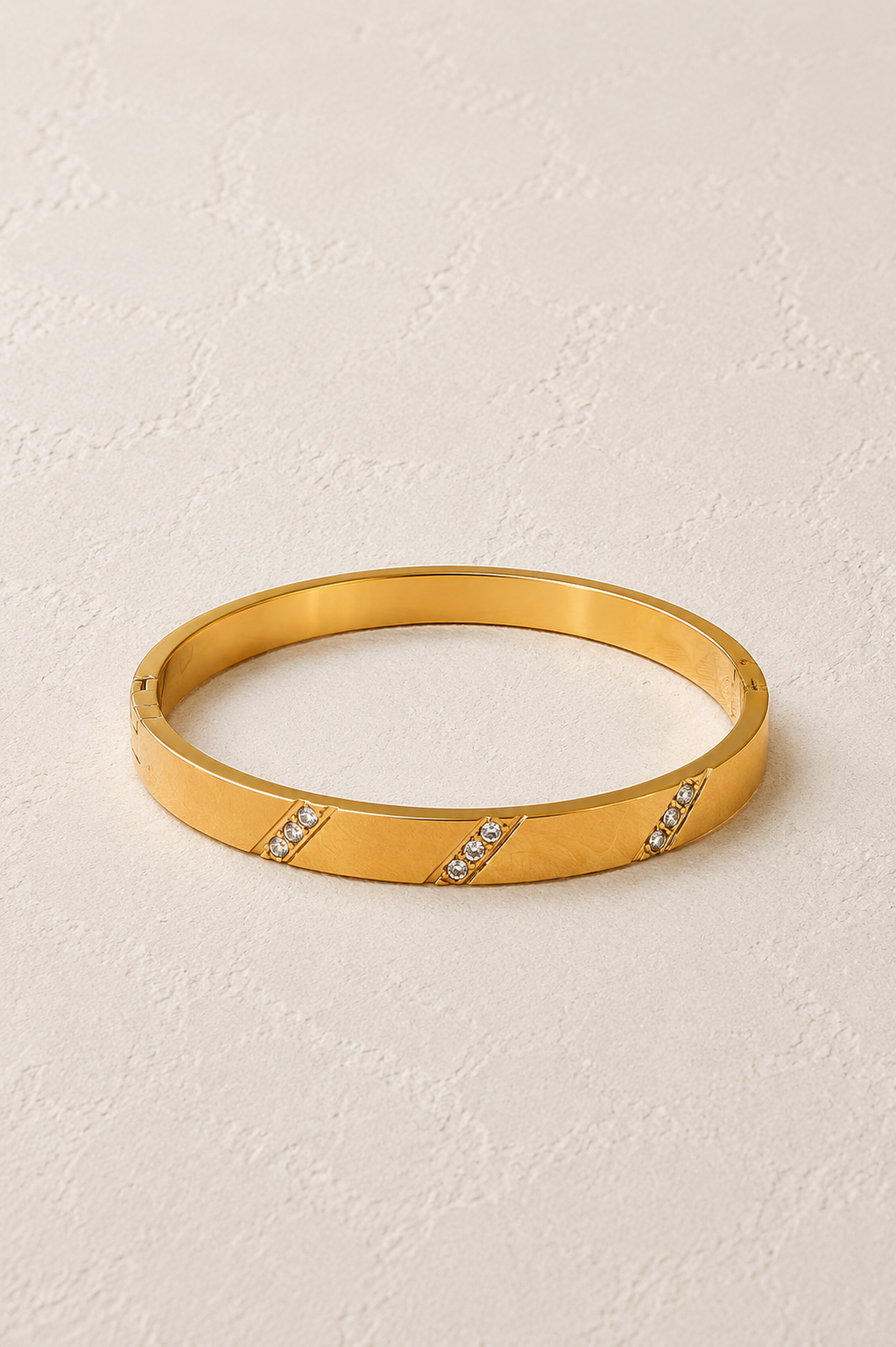 
                  
                    Lucienne Brushed Gold Diagonal Crystal Bangle – waterproof gold bangle by Boho & Mala
                  
                