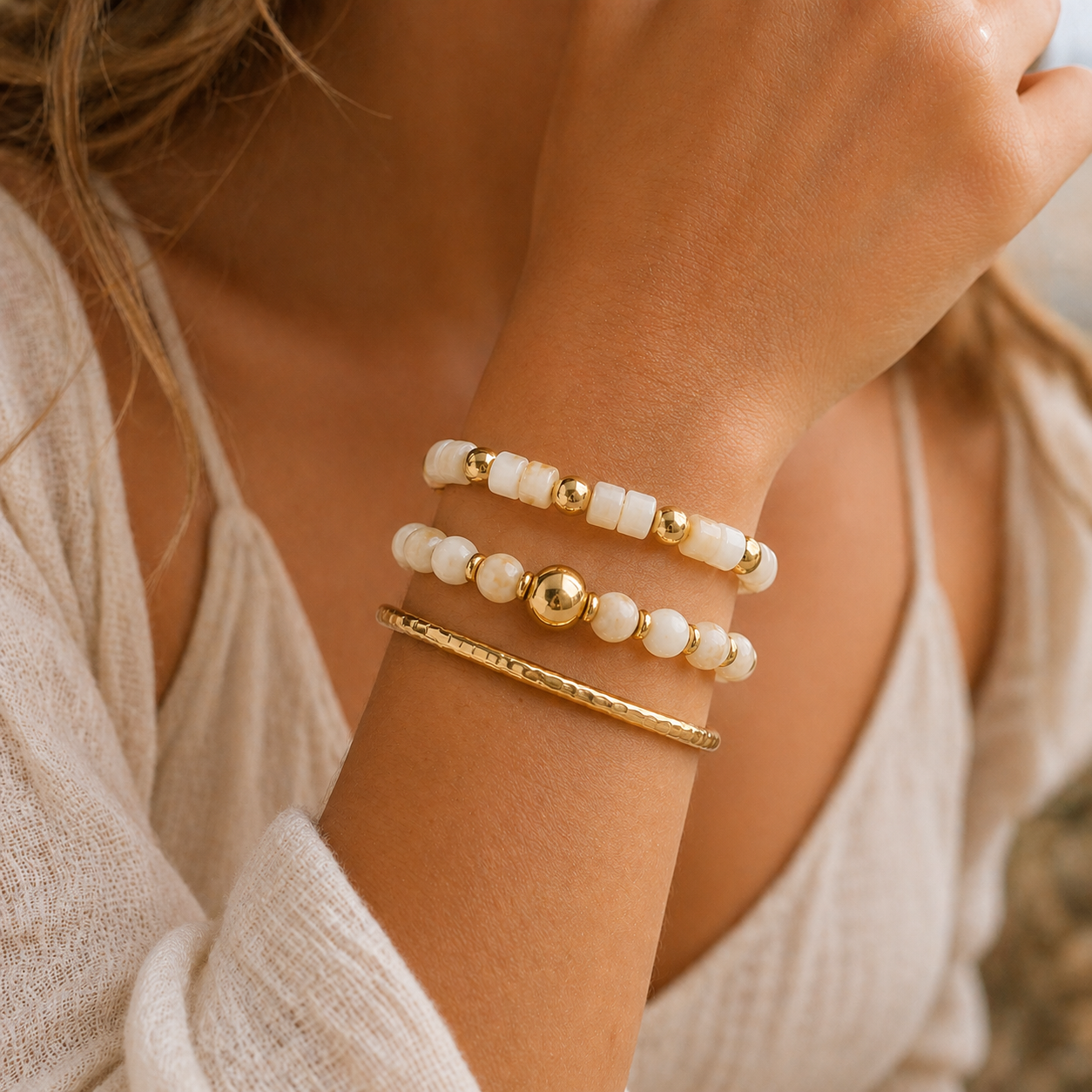 
                  
                    Ivory Glow Beaded Bracelet Stack worn on a model's wrist
                  
                