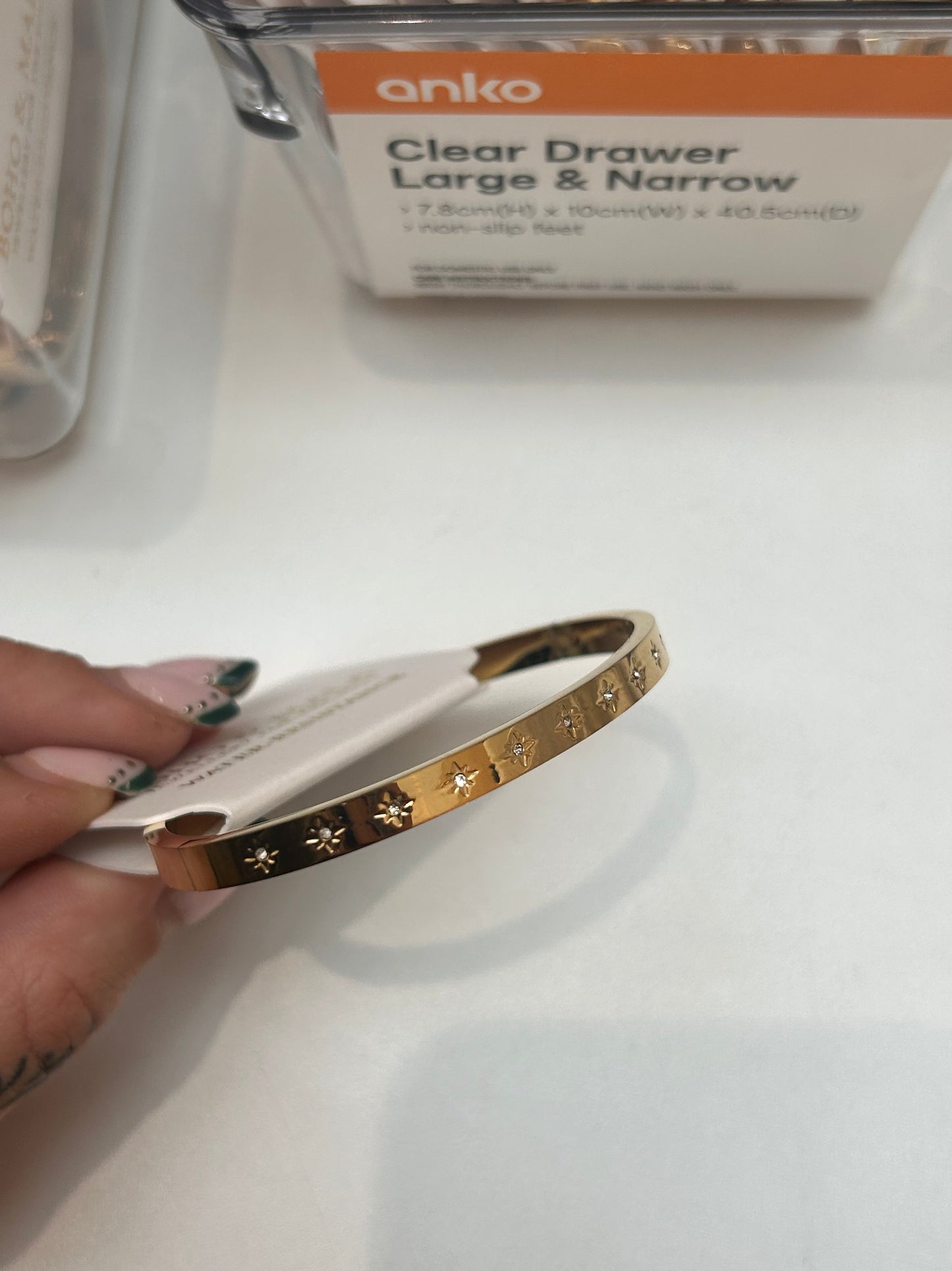 
                  
                    Celestia Gold Starburst Bangle — original display photo
                  
                