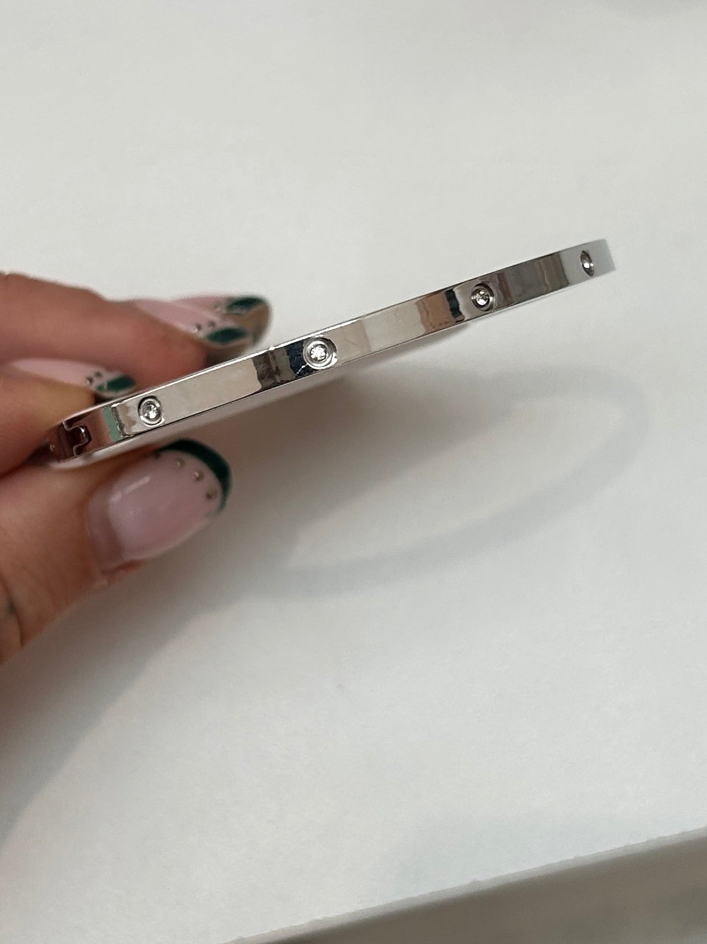 
                  
                    Celine Silver Scattered Crystal Bangle — original display photo
                  
                