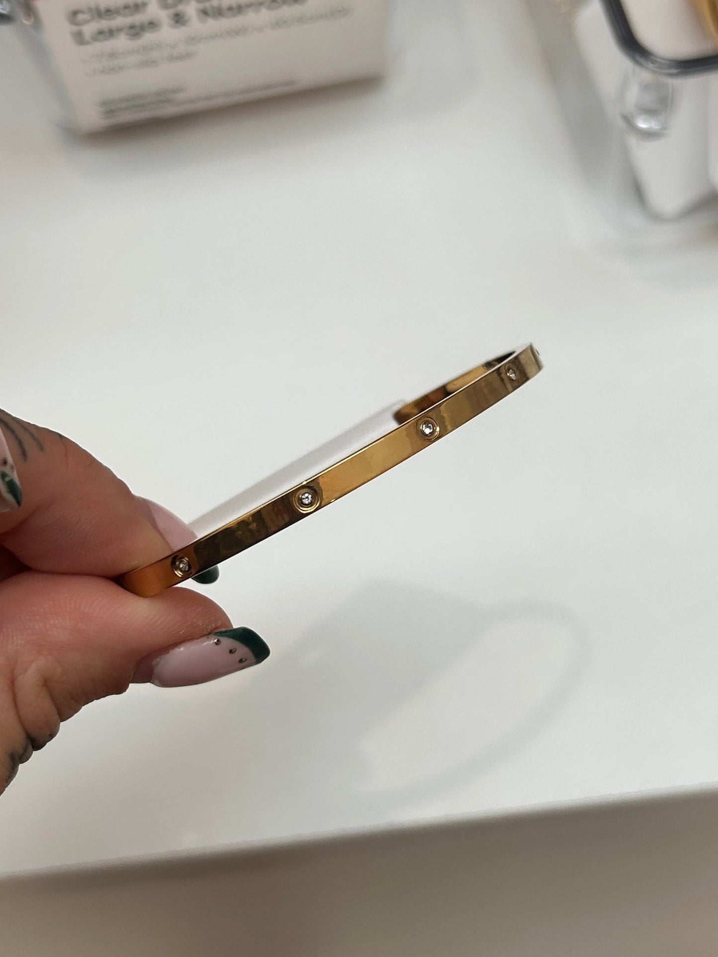 
                  
                    Celine Gold Scattered Crystal Bangle — original display photo
                  
                