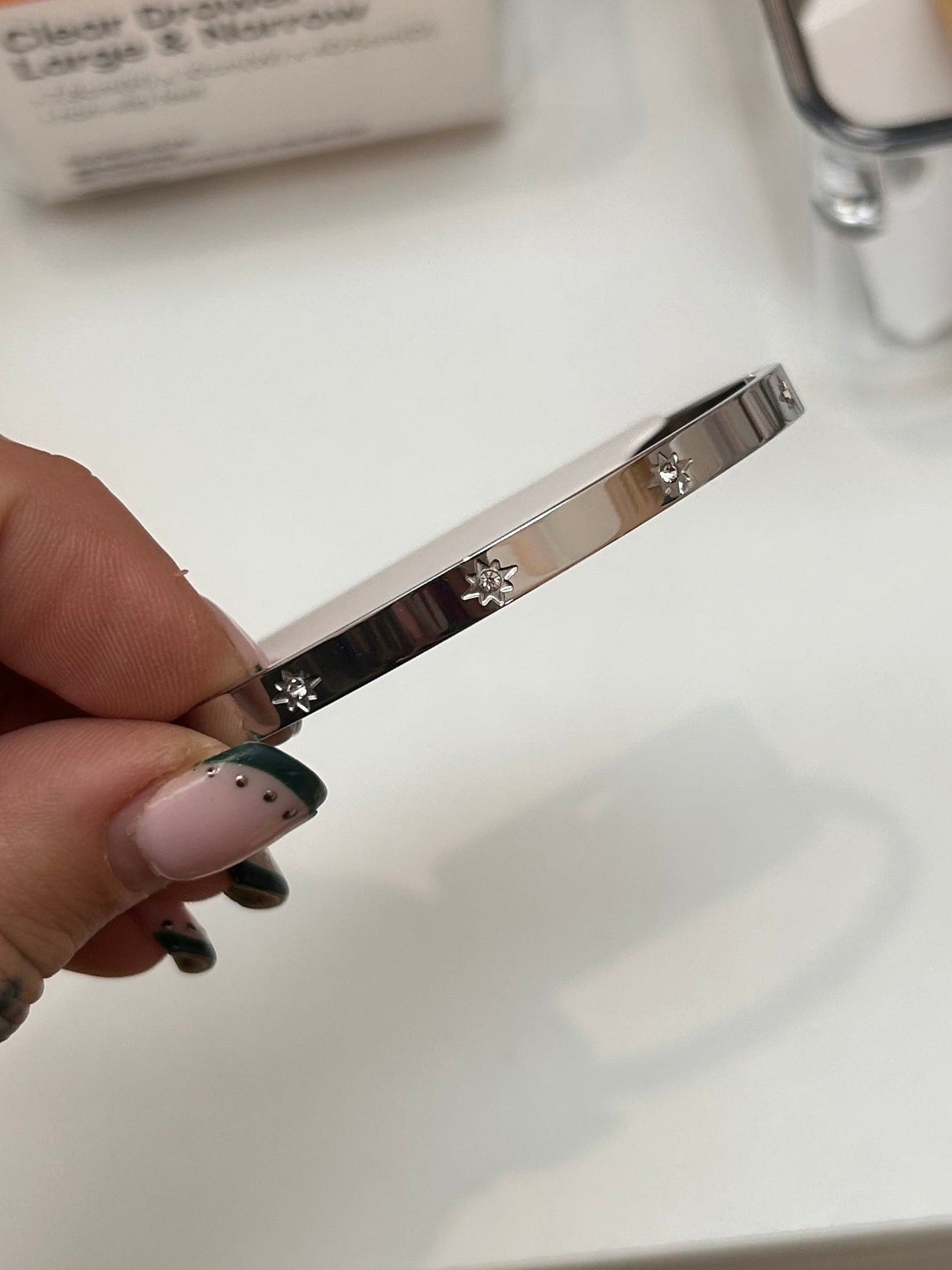 
                  
                    Aster Silver Diamond Motif Bangle — original display photo
                  
                