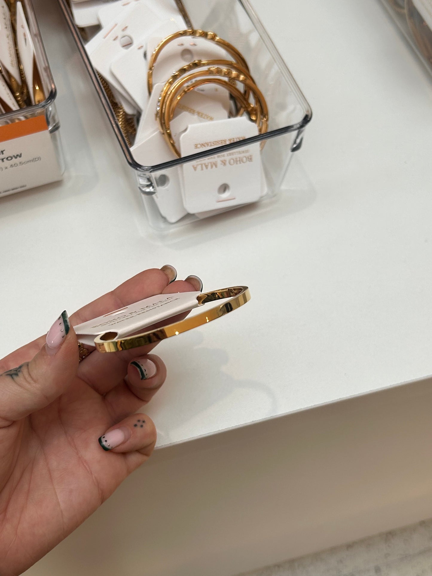 
                  
                    Elira Gold Row Bangle — original display photo
                  
                