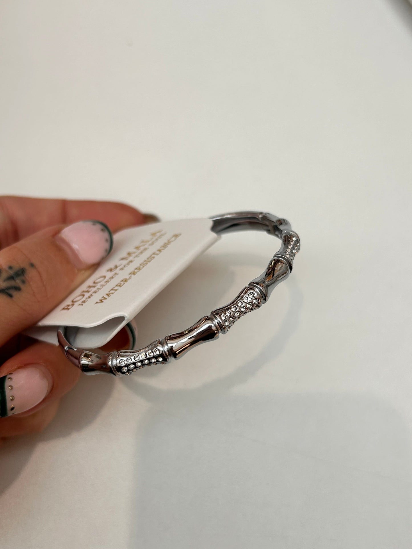 
                  
                    Serina Silver Ornate Crystal Bangle — original display photo
                  
                