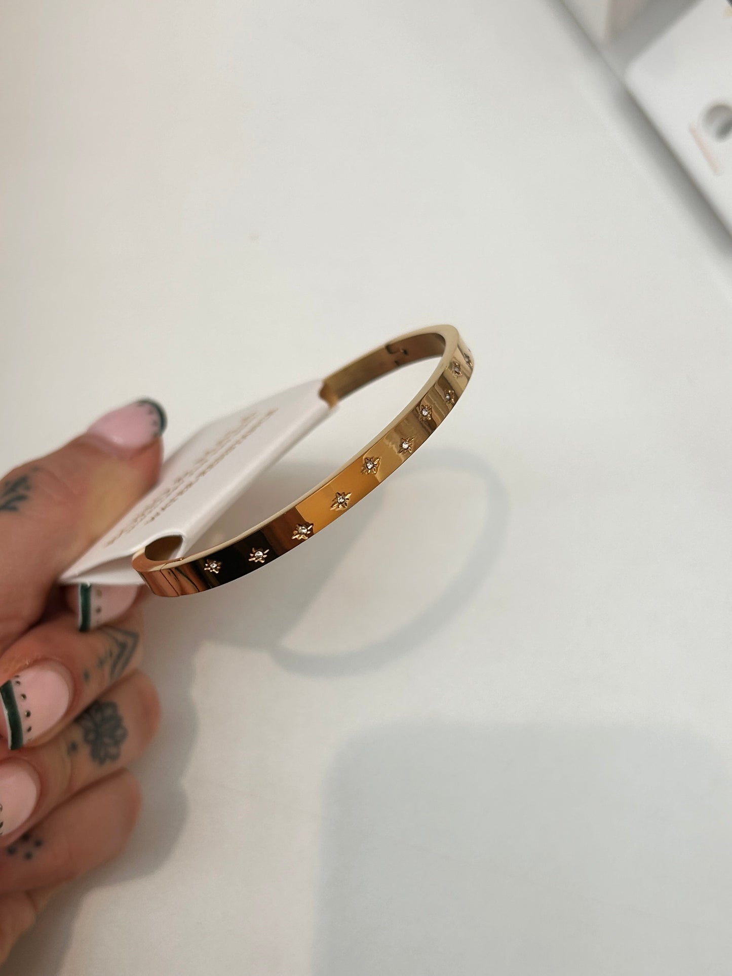 
                  
                    Estelle Gold Starlight Bangle — original display photo
                  
                