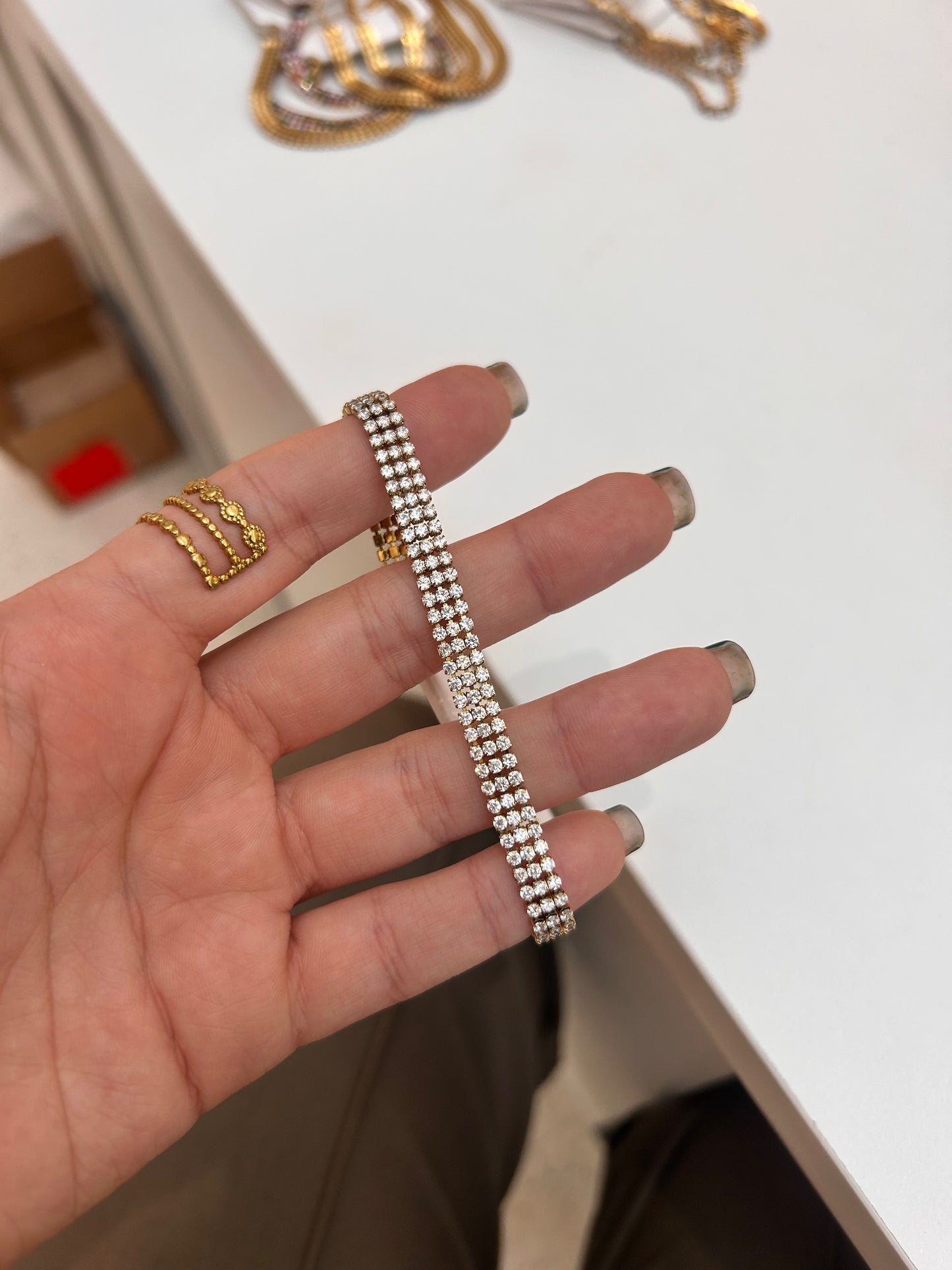 
                  
                    Luciana Gold Triple Row Crystal Tennis Bracelet original product detail photograph
                  
                