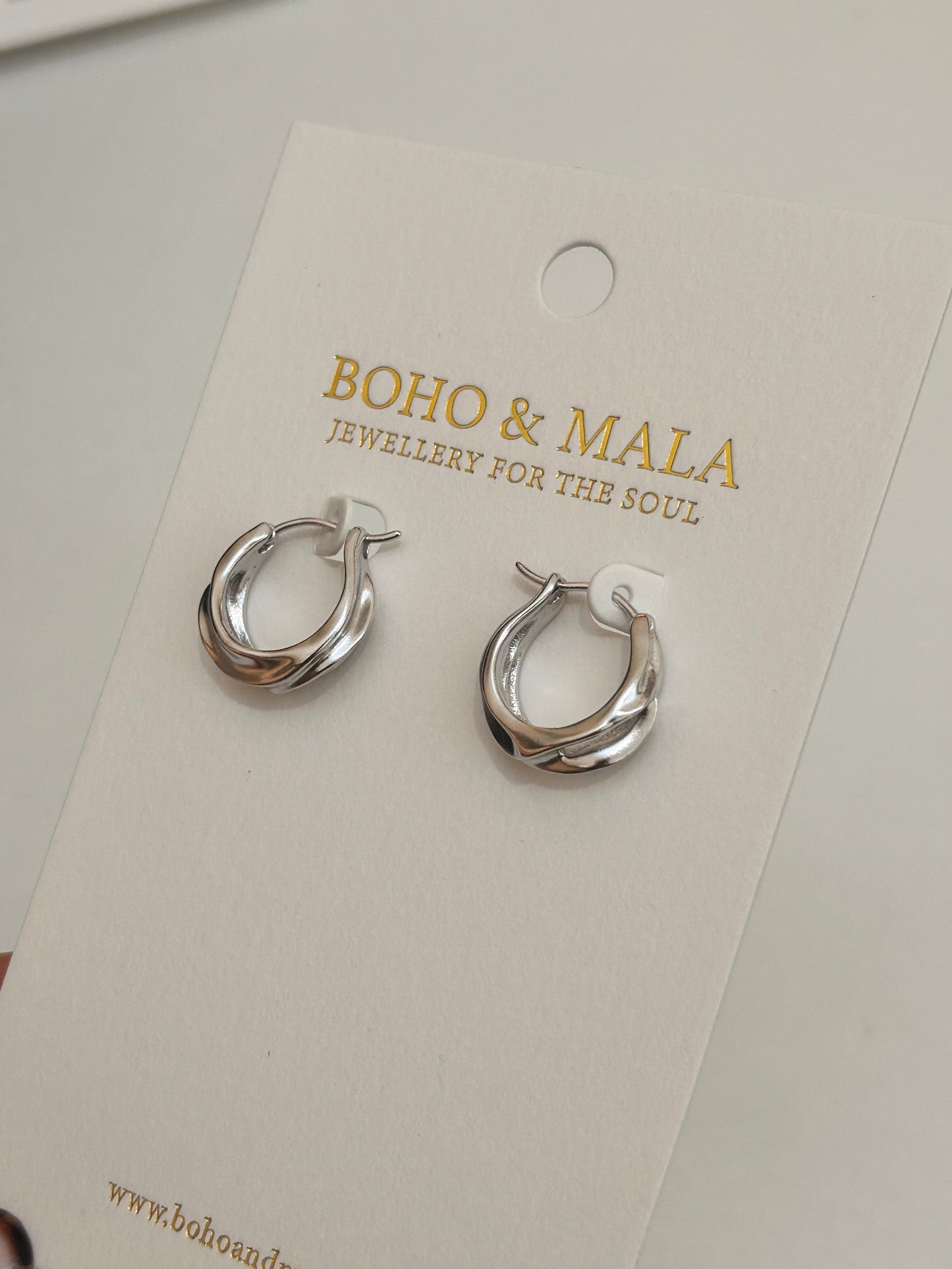 
                  
                    Vionne Silver Sculpted Twist Hoop Earrings
                  
                