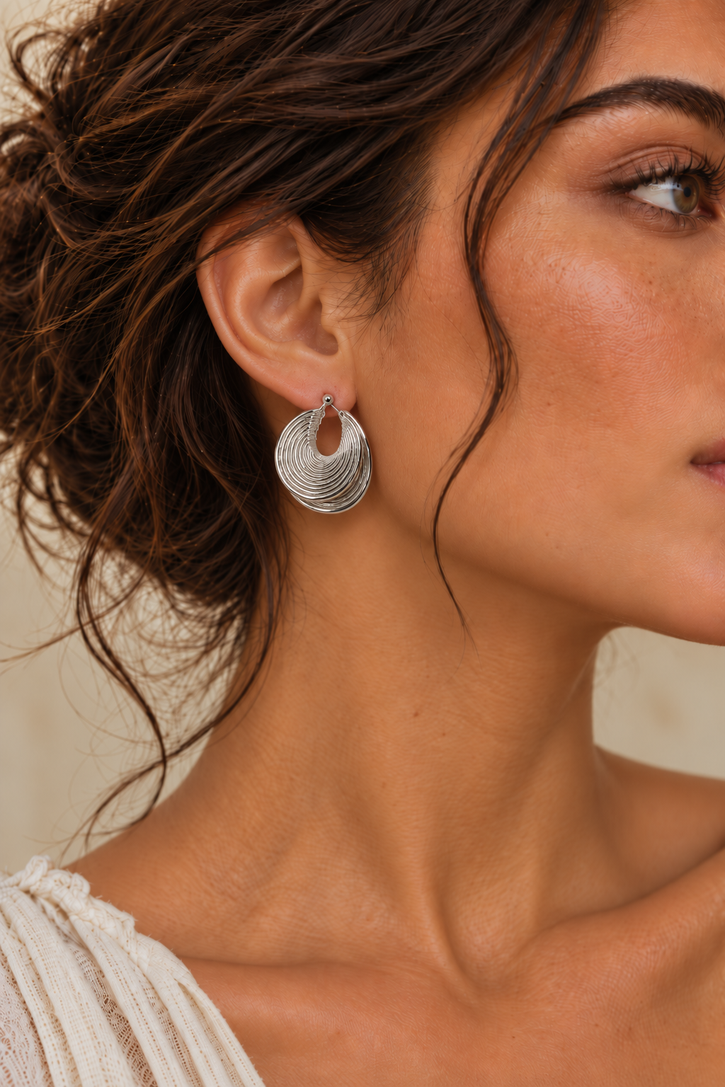 
                  
                    Ravena Silver Ripple Hoop Earrings
                  
                