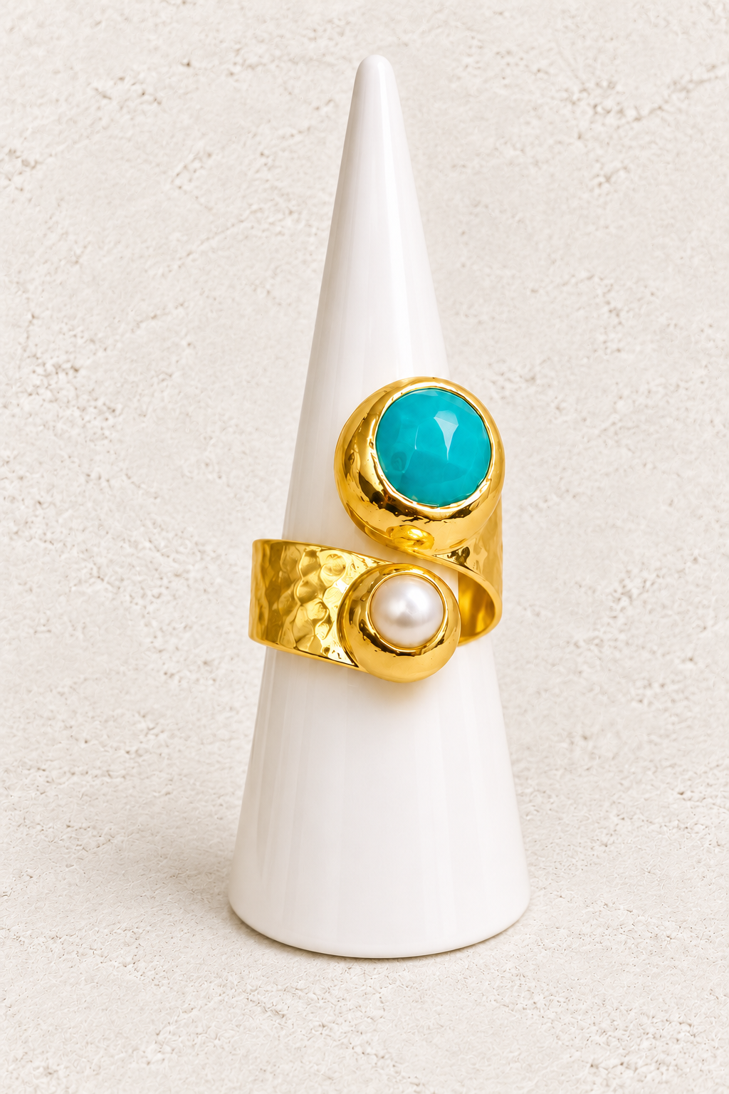 Alara Freshwater Pearl &  Amazonite Ring on white cone against warm textured background