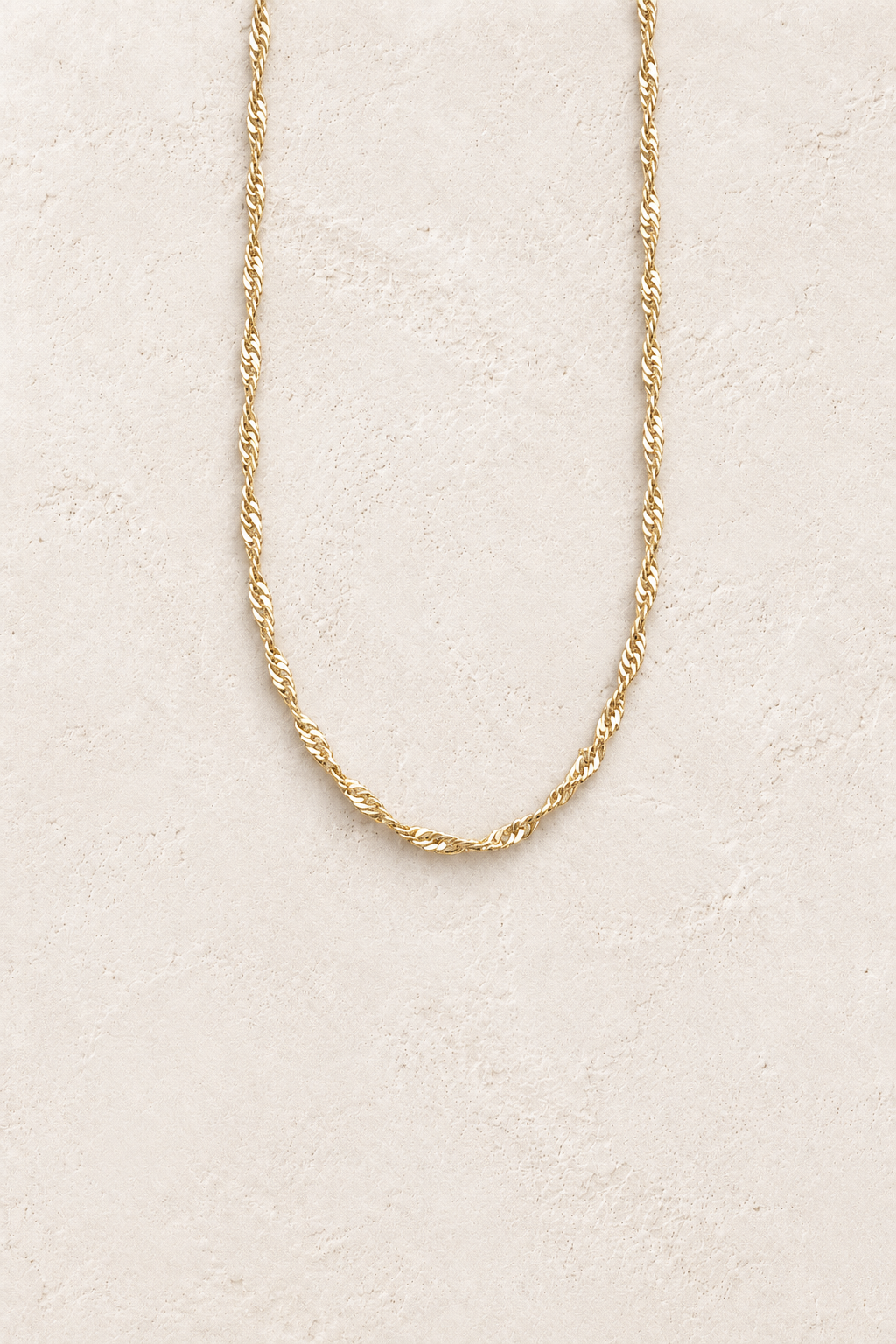 Gold Amalina Twist Chain Necklace on cream plaster – Boho & Mala jewellery