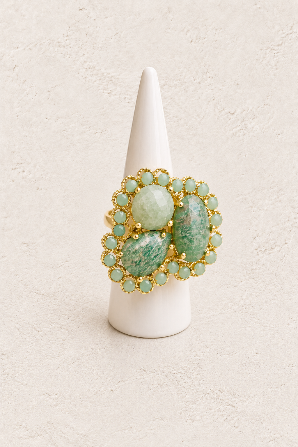 Amaris Amazonite Statement Ring on white cone against warm textured background