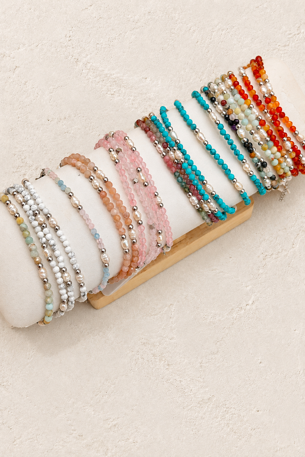 
                  
                    Anaya Silver Pearl & Natural Stone Beaded Bracelet on warm ivory plaster background
                  
                