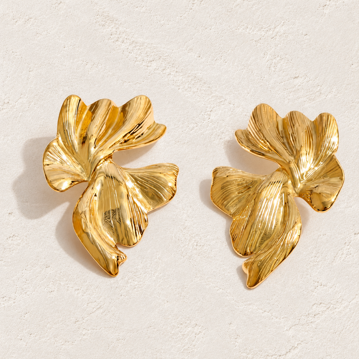 
                  
                    Sculpted Petal Statement Earrings in gold
                  
                